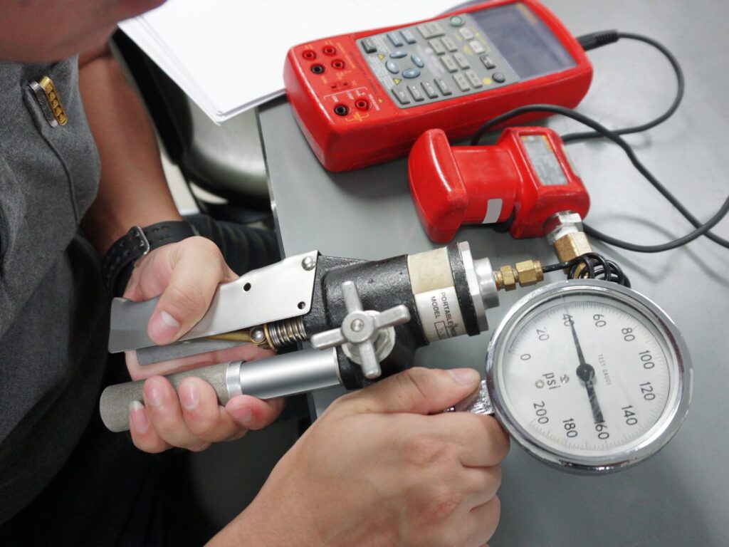 Technician calibrates a dial indicator