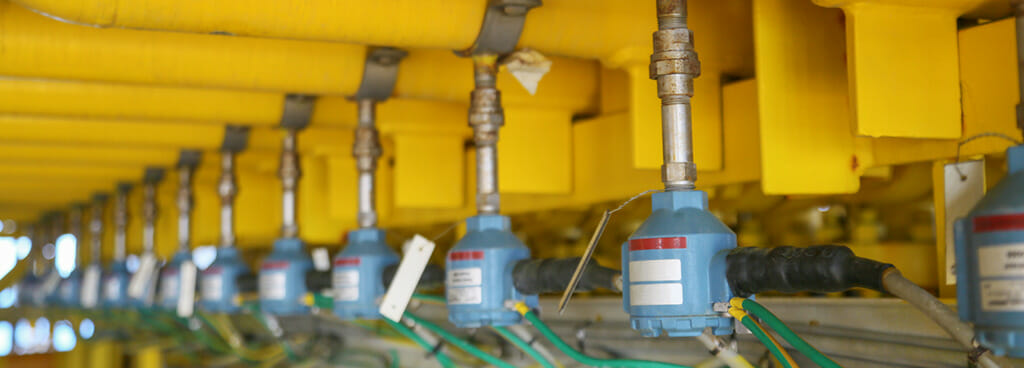 A system of yellow pipes, each with a separate temperature meter, a Resistance Temperature Detector (RTD).