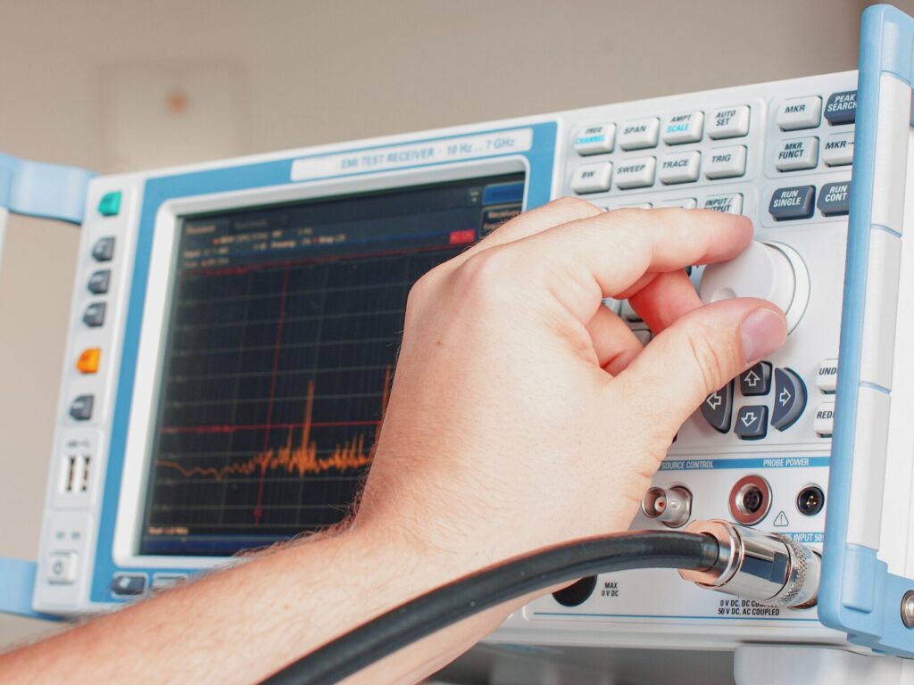 Technician adjusts an EMC Test Receiver