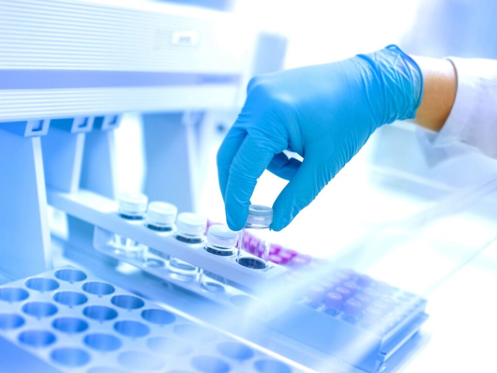 Chemist prepares sample for extractables and leachables testing
