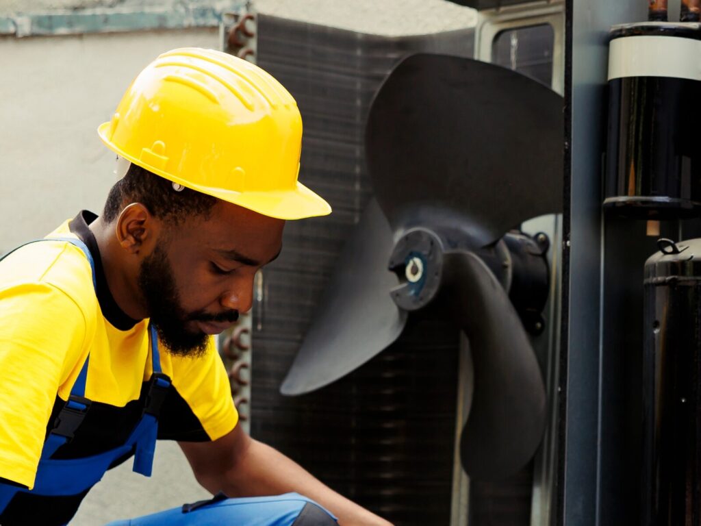 Reliability engineer in front of an industrial fan