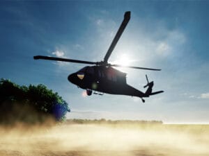 Blackhawk Helicopter Landing at Edge of Field