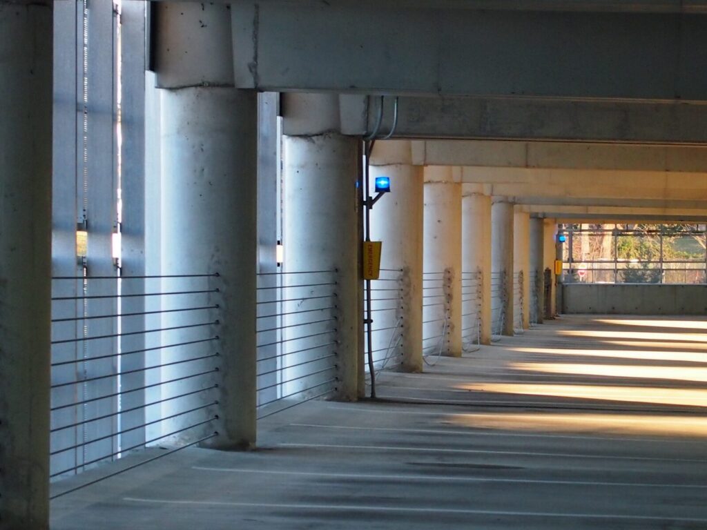 Parking deck wall with cable barriers