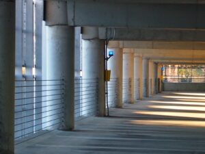 Parking deck wall with cable barriers