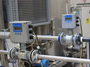 A Badger liquid flow meter installed on an indoor pipeline