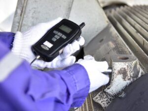 Handheld vibration tester used on a motor