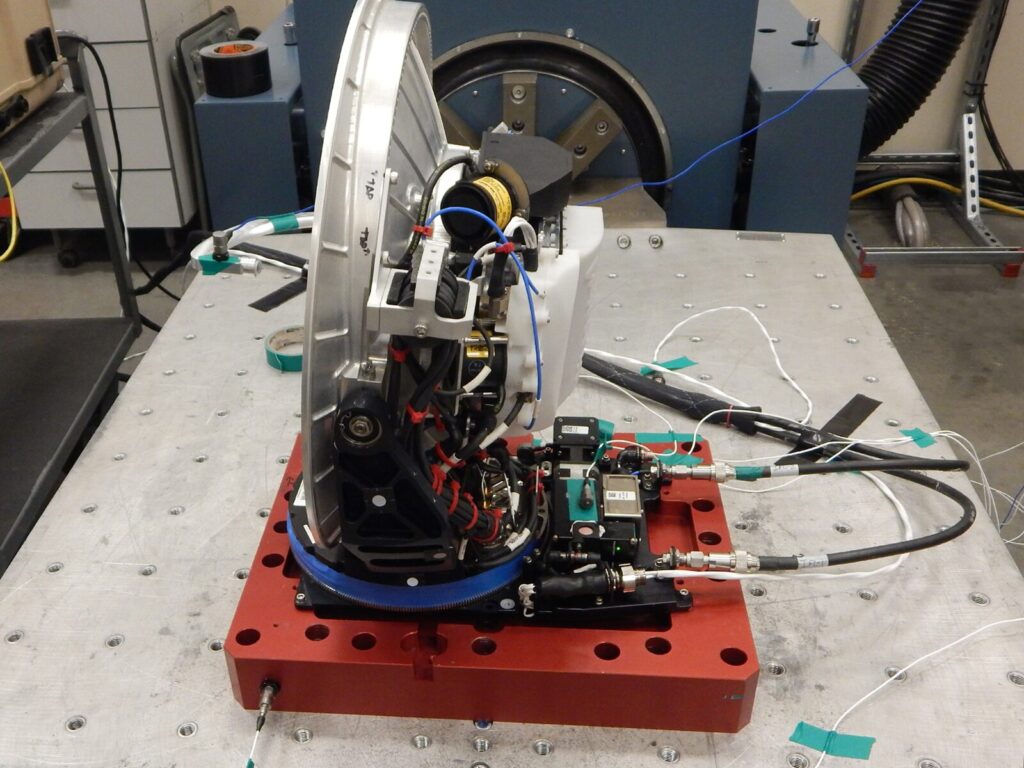 Side view of a satellite installed on a shaker table