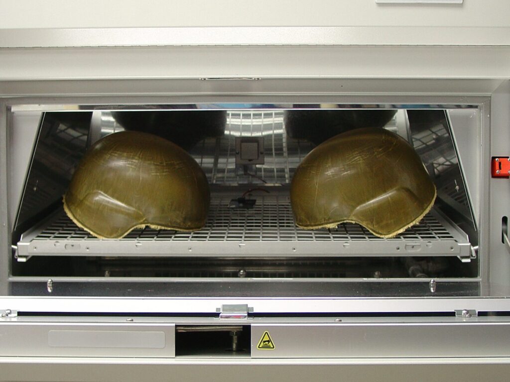 Two helmets in a Xenon weathering chamber
