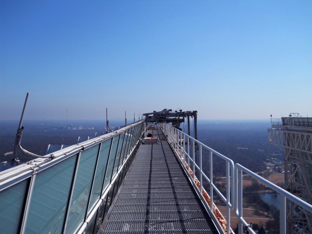 Elevated walkway with protective guardrails and davit system.