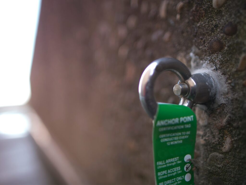 Focus on a roof tie back anchor and tag