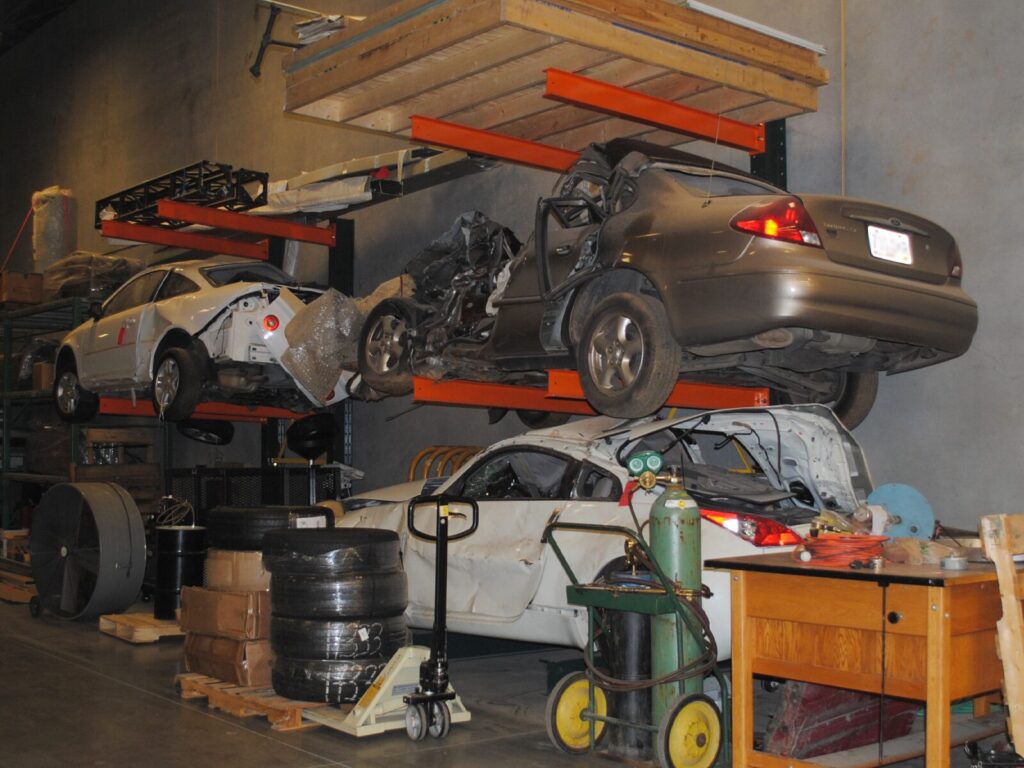 Shelves of crashed vehicles and forensic evidence in storage