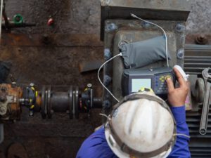 Overhead view of a technician performing laser shaft alignment