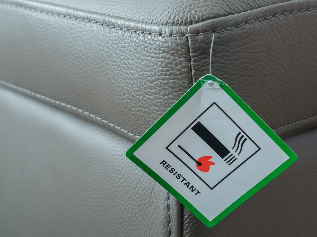 Leather upholstery with a flame resistant tag