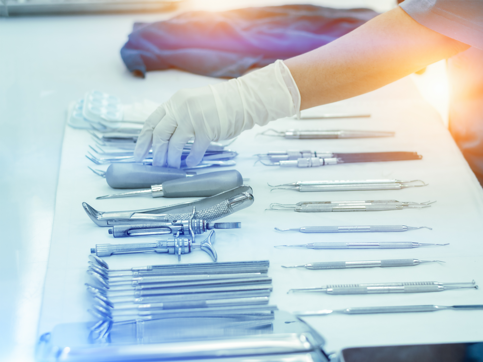 A series of medical instruments on a sterile cloth