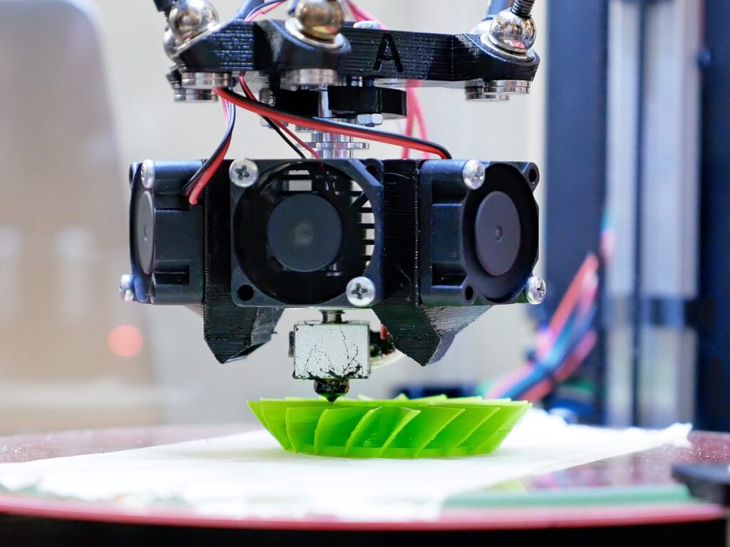 Focus on a 3D printer used in additive manufacturing