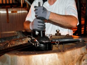 Nondestructive Testing technician lowers a borescope camera into a pressure vessel