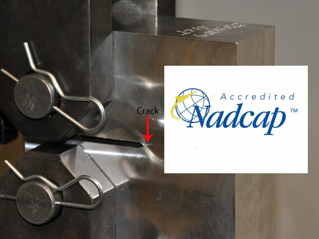 Focus on a fatigue test sample and the NADCAP logo