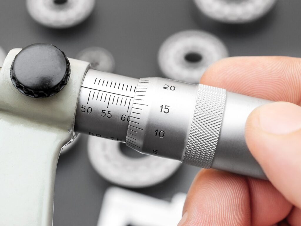 Technician holds a micrometer