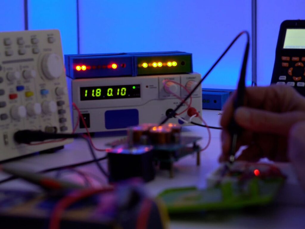 A tabletop covered with electrical testing machines