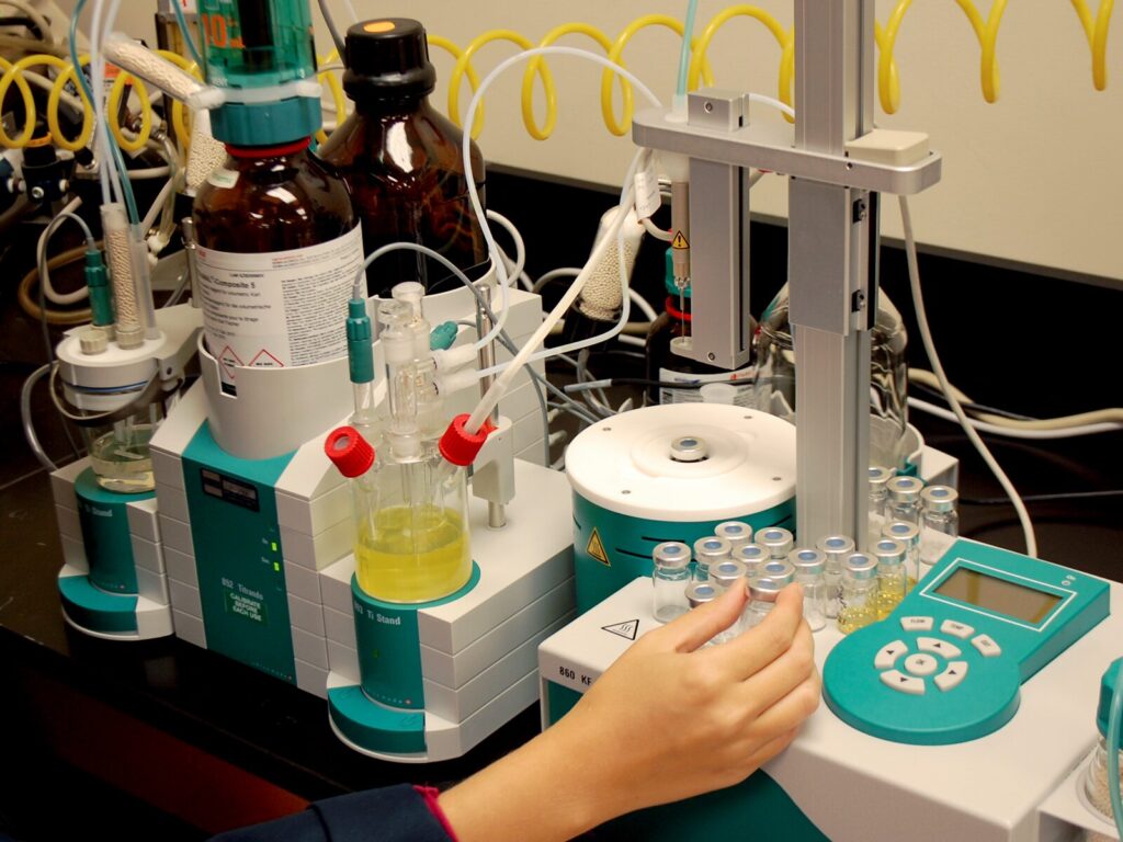Chemist operates a moisture analyzer for Karl Fischer testing