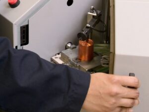 Optical emission spectrometer containing a copper sample.
