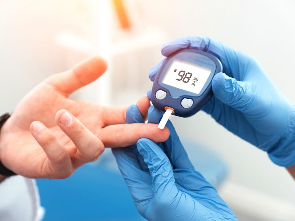 Medical expert measures a patient's blood sugar levels