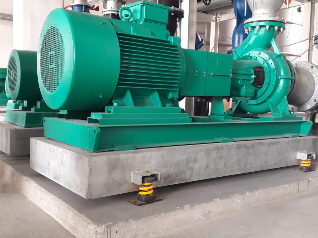 Chiller pump on a platform with a vibration spring