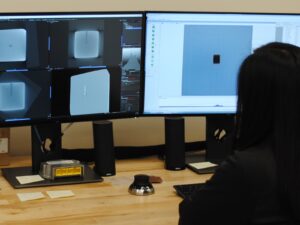 Engineer studies a tomograph of a component for reverse engineering