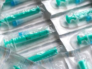 Individually packaged hypodermic needles