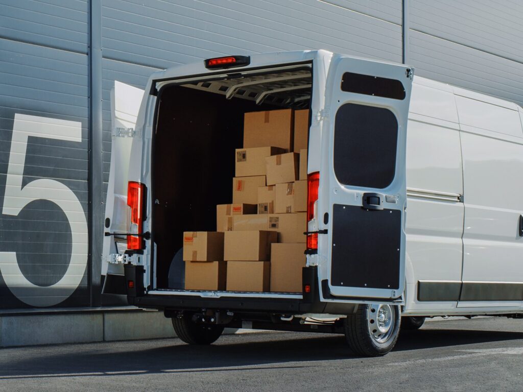 Open doors to a package delivery vehicle