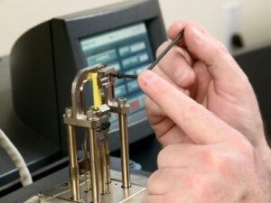Technician operates a Dynamic Mechanical Analyzer
