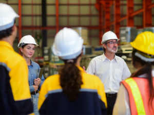 An engineer speaks to a team of technicians