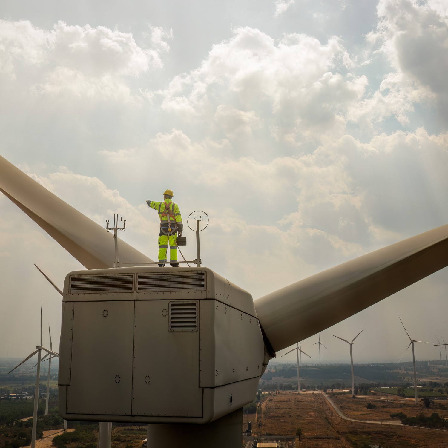 Technician Standing on Top of Old Windmill