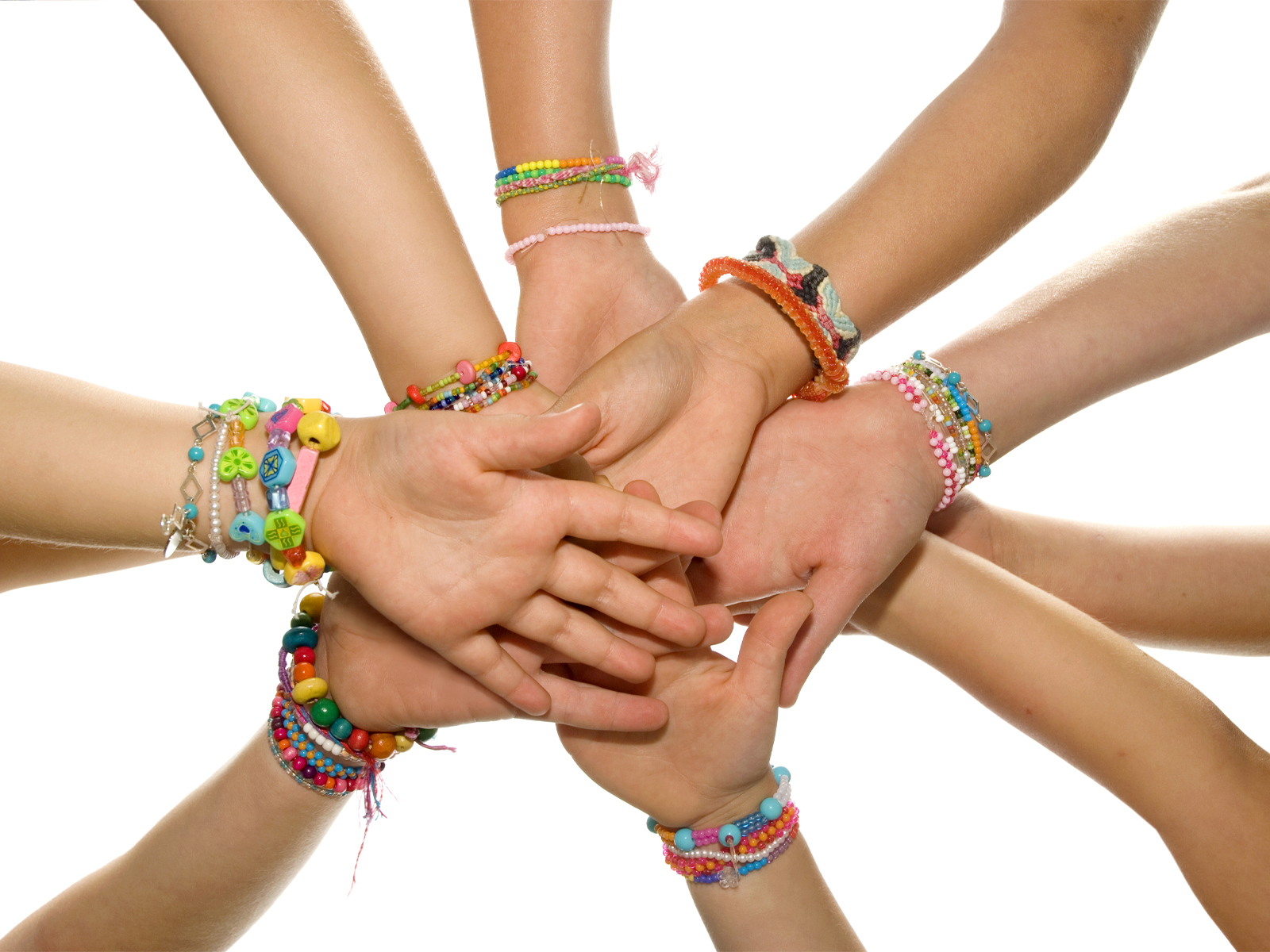 Circle of Children's Hands, Each Wearing Jewelry Tested to ASTM F2923
