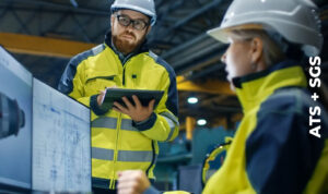 Two technicians reviewing data pertaining to equipment condition