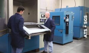Two technicians loading a sample for thermal cycling testing